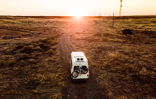 Class B Motorhome Driving through Deserted Land